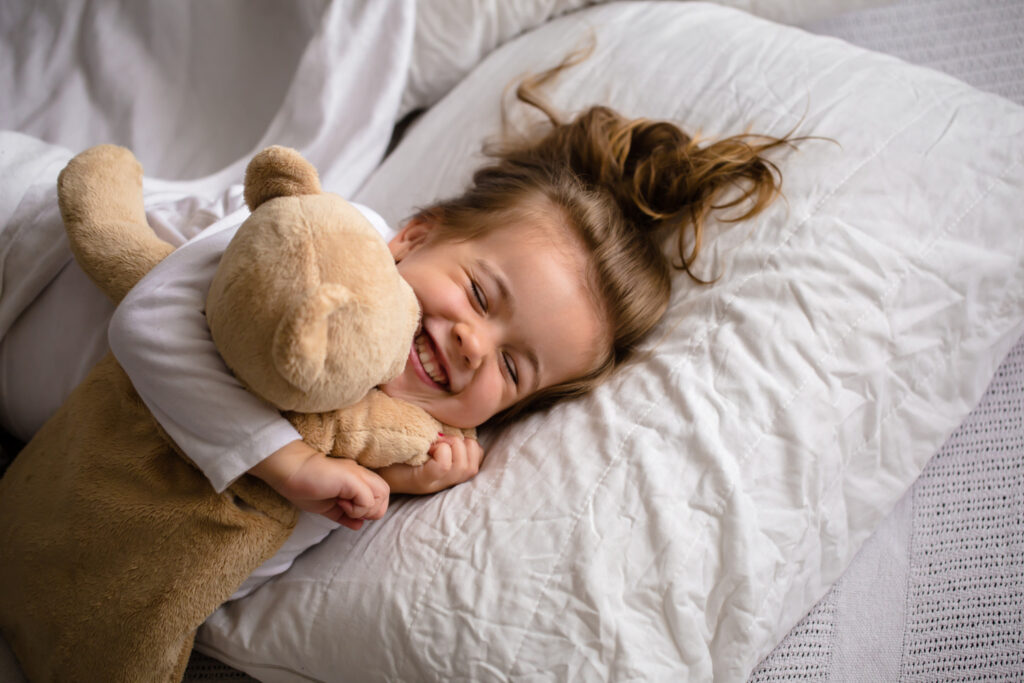 little girl bed with soft toy emotions child