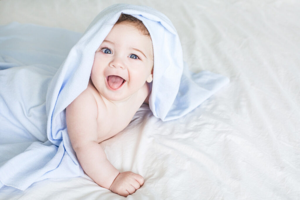 newborn toddler boy laughing bed 5